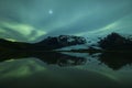 Northern lights above a lagoon in Iceland Royalty Free Stock Photo