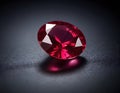 Exquisite Oval-Cut Ruby Gemstone, Isolated on Dark Reflective Surface Royalty Free Stock Photo