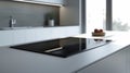Sleek modern kitchen with touch-control induction cooktop and minimalist design Royalty Free Stock Photo