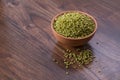 Fresh Green Tender Sorghum in a Earthen Bowl on Wooden Background