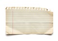 A high resolution isolated aged piece of lined notebook paper with a jagged torn edge on a clean white background surface Royalty Free Stock Photo