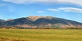 High resolution panorama of Western Tatras Zapadne Tatry, Liptov region with mount Baranec peak, green meadow in foreground, on Royalty Free Stock Photo
