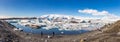 High Resolution Panoramic view with Tourists at Jokulsarlon Glacier Lagoon, Iceland, Europe, March 2019