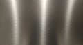 Brushed stainless steel texture with vertical sheen Royalty Free Stock Photo