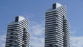 High-rise Apartment Building against blue sky. Modern, luxury apartment building with blue sky at background. Royalty Free Stock Photo