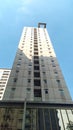 high rise apartment building against a bright blue sky in the background? Royalty Free Stock Photo