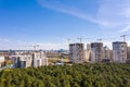 High-rise apartment buildings construction site with cranes against blue sky Royalty Free Stock Photo