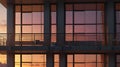 A high-rise balcony with soft sunset reflections on its glass windows Royalty Free Stock Photo