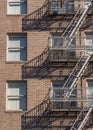 High-rise Brick Building with Fire Escape Ladder Royalty Free Stock Photo