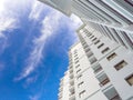 High rise building and bright blue sky Royalty Free Stock Photo