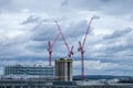 High rise building construction with red cranes over London. Royalty Free Stock Photo