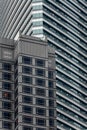 High-rise building facade with glass ans steel near Petronas twin towers in Kuala Lumpur, Malaysia Royalty Free Stock Photo