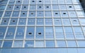 High-rise building made of glass from the outside. Facade of business center, close-up. Exterior of modern office Royalty Free Stock Photo