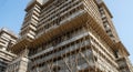 High- Rise Building Under Construction Covered in Bamboo Scaffolding and Tarps Keywords: construction, building, skyscraper, high- Royalty Free Stock Photo