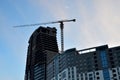 High-rise building under construction with a crane working Royalty Free Stock Photo