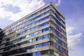 High rise building and window cloud reflection on the glass in business concept lookup to the angle of building corner Royalty Free Stock Photo