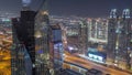 High-rise buildings on Sheikh Zayed Road in Dubai aerial day to night timelapse, UAE. Royalty Free Stock Photo