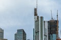 High-rise buildings and skyline in a big city with cranes and construction machinery under a beautiful blue sky Royalty Free Stock Photo