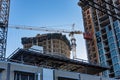 High-rise buildings under constraction with external elevator on the wall