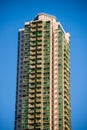 High rise condominium building against blue sky background Royalty Free Stock Photo