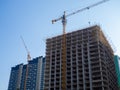 High-rise construction. Skyscraper under construction. Housing frame. Multi-apartment housing. Building cranes. New area Royalty Free Stock Photo