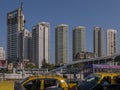 High rise developments by Mahalaxmi Station and the Western Railways train of the Mumbai Suburban Railway