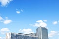 High-rise glass buildings against blue clouds, empty space for text Royalty Free Stock Photo