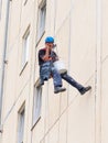 High-rise installer talking on the phone