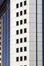 High-rise multi-storey, apartment building close-up in gray. Royalty Free Stock Photo