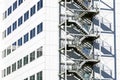 High rise office building with shadow of metal fire escape Royalty Free Stock Photo