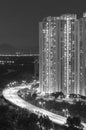 High rise residential building and highway in Hong Kong city at night Royalty Free Stock Photo