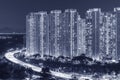 High rise residential building and highway in Hong Kong city at night Royalty Free Stock Photo