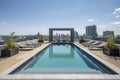 high-rise with rooftop pool and lounging area, surrounded by breathtaking city views Royalty Free Stock Photo