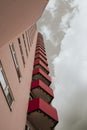 A high-rise with small red balkons with a view from below Royalty Free Stock Photo