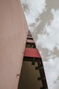 A high-rise with small red balkons with a view from below Royalty Free Stock Photo