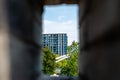 High-rise in the trees through the window. Jinhua. China