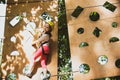 High ropes walk. Cute school little girl boy enjoying a sunny day in a climbing adventure activity park. Go Ape Royalty Free Stock Photo