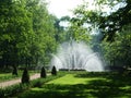 Petergof, Saint peterburg, Russia - JUNE 12, 2013: High round lush white fountain in the park of Petergof. Royalty Free Stock Photo