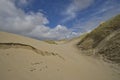 High sand dunes with beach grass at the North Sea Royalty Free Stock Photo
