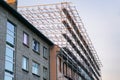 High scaffold for temporary roof being erected around a building to re-roof to be carried out Royalty Free Stock Photo