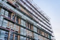 High scaffold for temporary roof being erected around a building to re-roof to be carried out Royalty Free Stock Photo