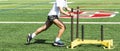 Runner pushing a yellow sled on a turf field Royalty Free Stock Photo
