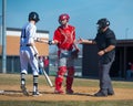 High School Baseball batter hands ball to catcher Royalty Free Stock Photo