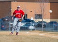 High School Baseball first baseman watches the pitch Royalty Free Stock Photo