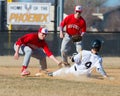 High school baseball shortstop tags sliding runner Royalty Free Stock Photo