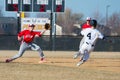 High school baseball shortstop takes a throw