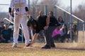 High school baseball umpire dusts off home plate