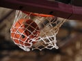 Basketball Going Through A Basketball Hoop.