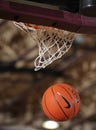 Basketball Going Through A Basketball Hoop. Royalty Free Stock Photo
