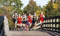 High school boys 5K race running over the bridge at Sunken Meado